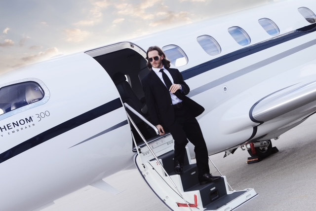 Russell Snipes. Lifestyle shot stepping off a private jet