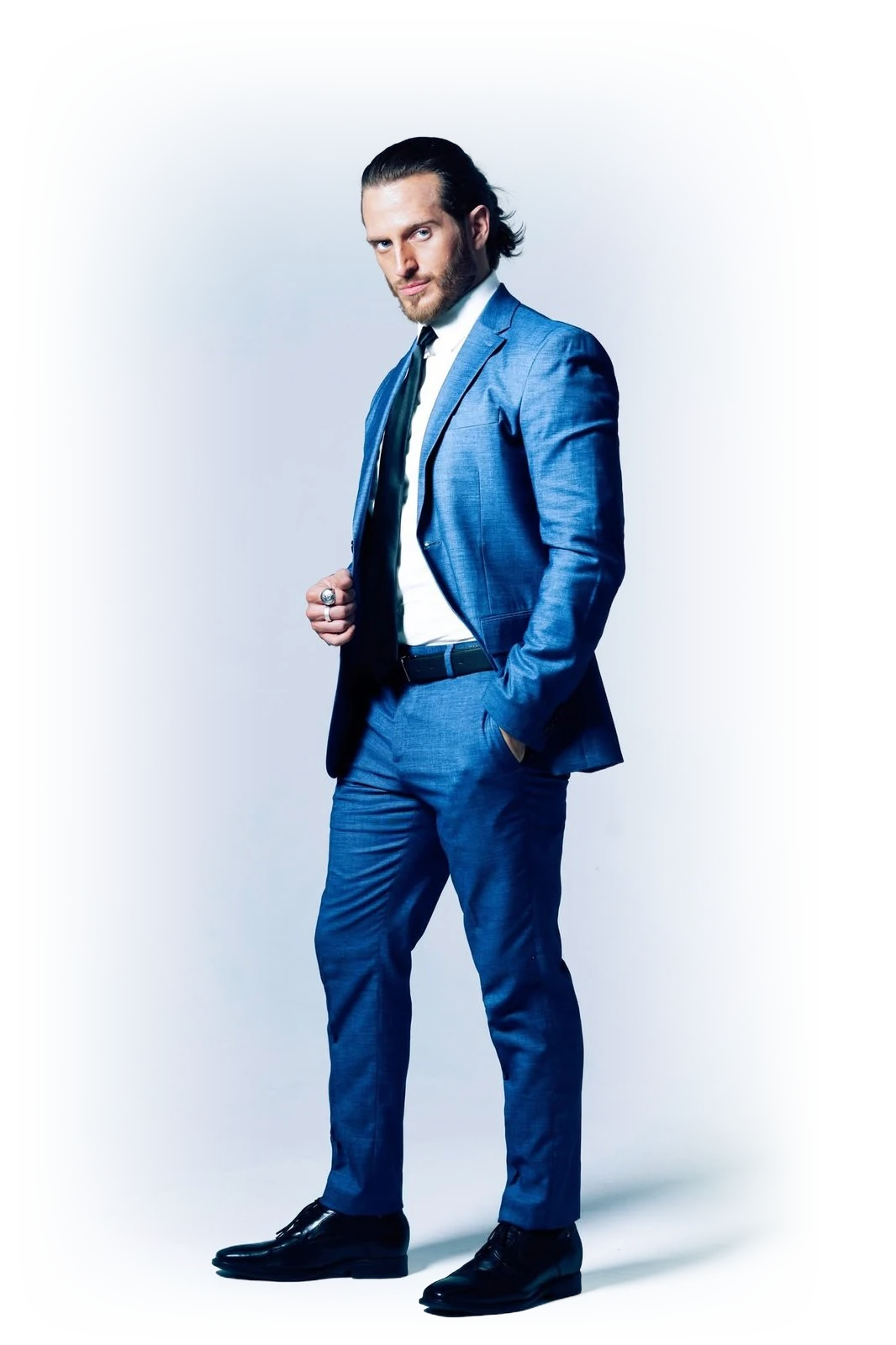 Russell Snipes, full-length in a blue suit